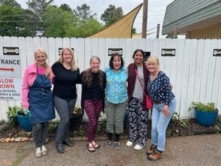 A group of women standing next to each other.