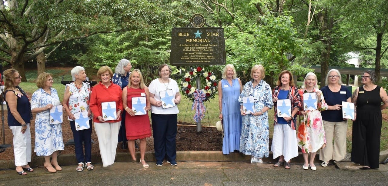 Sponsors of the marker were presented certificates by Donna Donnelly, NGC President. From left, Donnelly, Hunter, Marilyn Aldrich, Melodie Smith, Christy Novellas, Bonnie Dudley, Ginny Wolfe, Martha Cobb, Jan Stewart, Mikel Vann, Amy Williams, Beth Davis.