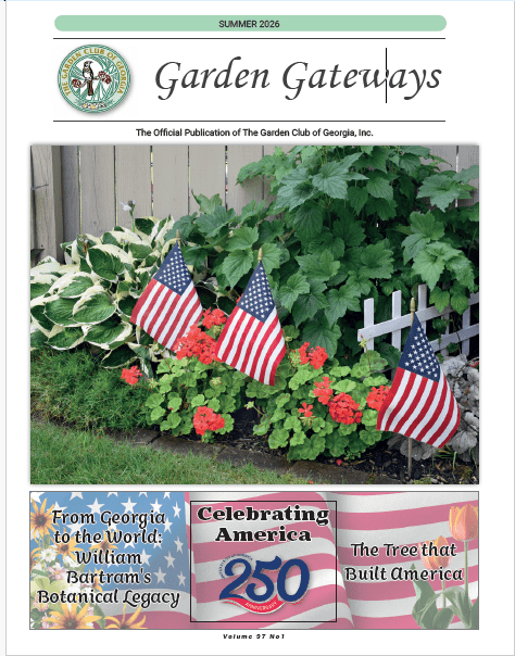 Garden bed with American flags and red flowers
